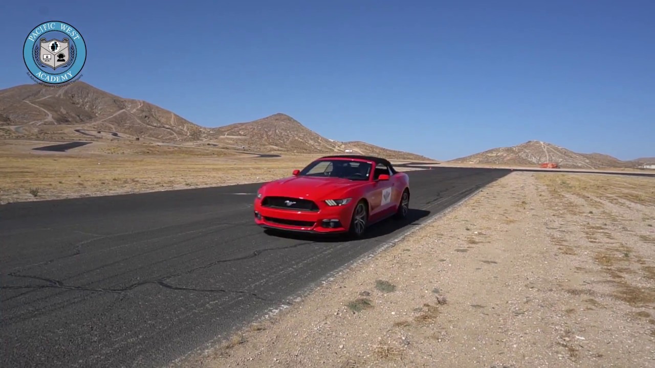 red car on vehicle training track for Evasive Defensive Driving course at PWA.edu
