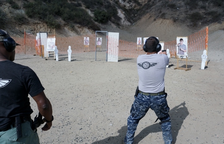 teacher overseeing a students in PWA's Handgun Shooting Tactics course