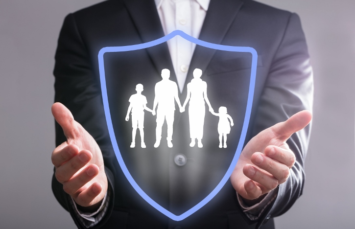 Man holding virtual shield protecting family - Why private personal security might be for you
