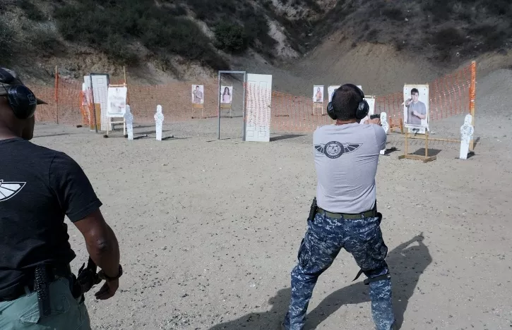 teacher overseeing a students in PWA's Handgun Shooting Tactics course