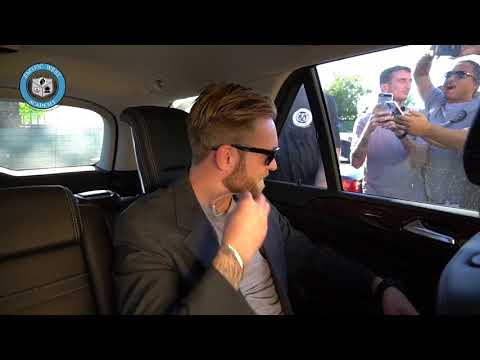 Man in car with people taking pictures - Executive Protection Fundamentals at PWA.edu